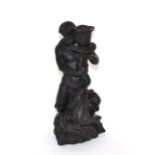 A Wedgwood black basalt candlestick figure modelled as Triton