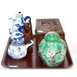 A group of Oriental items including a carved box, ginger jar and cover, teapot etc