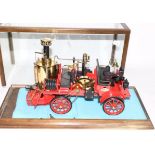 Wilesco Live Steam Fire Engine with four figures, in glass cabinet (E)