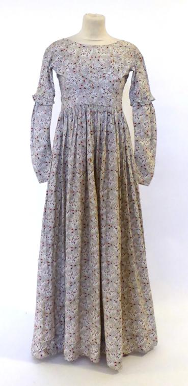 Circa 1845 Floral Cotton Ladies Dress, sleeves shaped at elbow at which point there are three tucks,