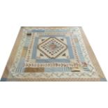 Early 19th Century Pieced and Appliquéd Quilt, in mainly pastel shades of blue, beige and pink,