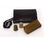 A Victorian Brass Needle Case 'The Quadruple Golden Casket', together with a leather needle case and
