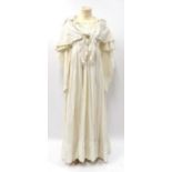 Circa 1845 White Cotton Ladies Dress, wide sleeves culminating in fitted cuffs, decorative