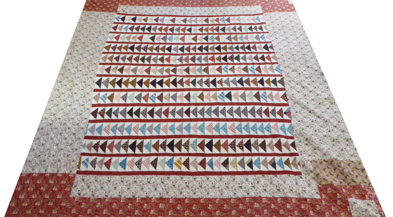 Early 19th Century Pieced Quilt in the Flying Geese Pattern, predominant colours of cream and dark