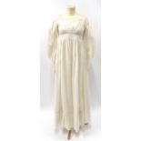 Circa 1835 Ladies White Cotton Dress, wide sleeves tapering to narrow cuffs, extremely gathered