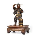 A Japanese Gilt and Patinated Bronze Figure of a Swordsman, by Miyao, Meiji period (1868-1912),