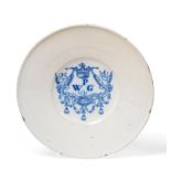 A Delft Marriage Plate, dated 1681, the central well painted in blue with a crowned scroll cartouche