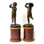 A Pair of French Bronze Figures of Musical Putti, late 19th century, in the manner of Clodion,