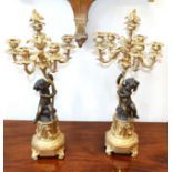 A Pair of French Gilt and Patinated Bronze Six-Light Candelabra, 19th century, with foliate