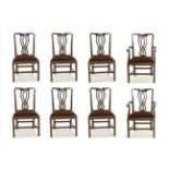 A Set of Eight Mahogany Dining Chairs, late 19th/early 20th century, including two carvers, with