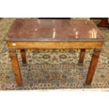 A Charles X Maplewood Table-de-Milleu, early 19th century, with an Egyptian red porphyry slab within