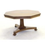 A Regency Rosewood Octagonal Shaped Centre or Dining Table, early 19th century, raised on a