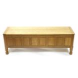 Mouseman: A Robert Thompson Panelled English Oak Blanket Chest, rectangular adzed hinged top, on