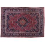 Doruksh Carpet East Iran, circa 1910 The raspberry field of large palmettes and vines around an