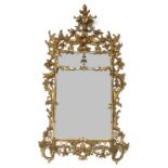 A Rectangular Pier Glass, of Chippendale Director design, the carved giltwood and gesso frame with