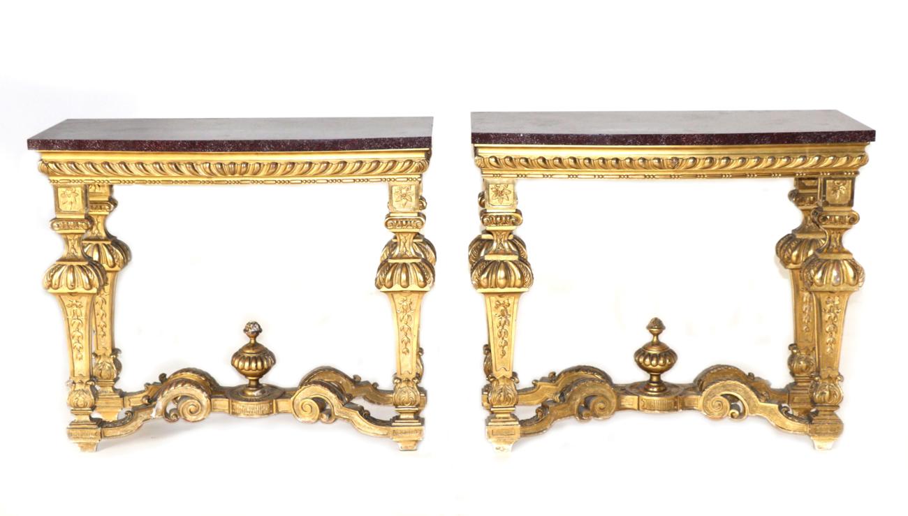 A Pair of 19th Century Giltwood Pier Tables, of Régence design, the bowed Egyptian porphyry marble