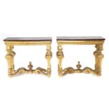 A Pair of 19th Century Giltwood Pier Tables, of Régence design, the bowed Egyptian porphyry marble