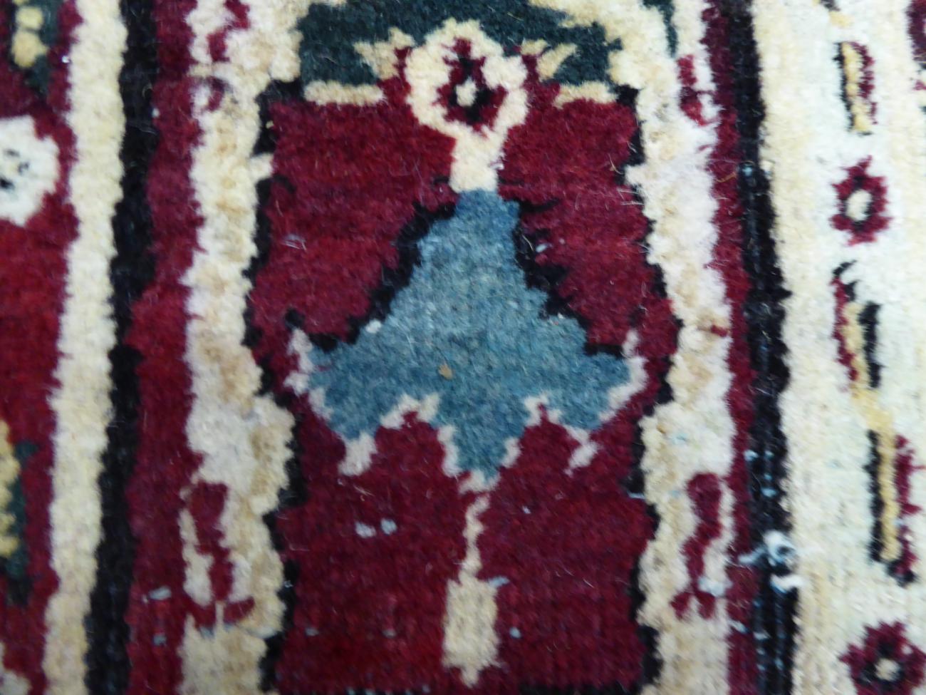 Agra Carpet Central/North India, late 19th century The abrashed raspberry field with an allover - Image 7 of 7