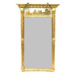 A Regency Gilt and Gesso Pier Glass, early 19th century, with a breakfront ball surmounted