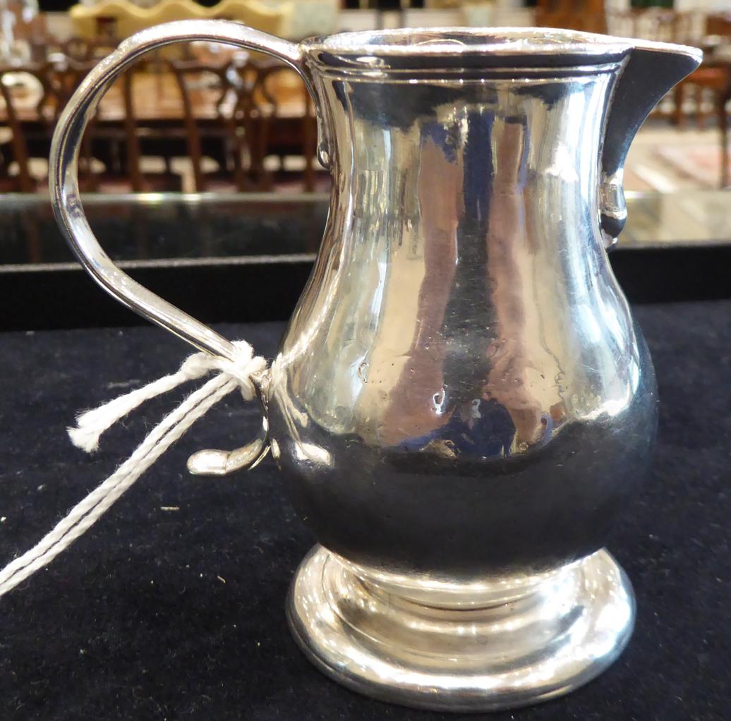 A George II Provincial Silver Cream Jug, Richard Richardson, Chester 1729, plain baluster form on - Image 5 of 6