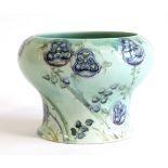 William Moorcroft (British, 1872-1945): for Liberty & Co, A Tudor Rose Pattern Vase, on a jade