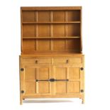 Mouseman: A Robert Thompson 4ft English Oak Welsh Dresser, the open delft rack with two fixed