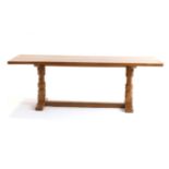 Mouseman: A Robert Thompson English Oak 7ft Rectangular Refectory Table, on two carved octagonal