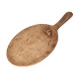 Mouseman: A Robert Thompson English Oak Cheese Board, with carved mouse signature on the board,