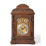 A Carved Oak Chiming Table Clock, circa 1890, elaborately carved case with scroll, floral and mask