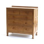 Mouseman: A Robert Thompson English Oak Chest of Drawers, with raised upstand, above two short