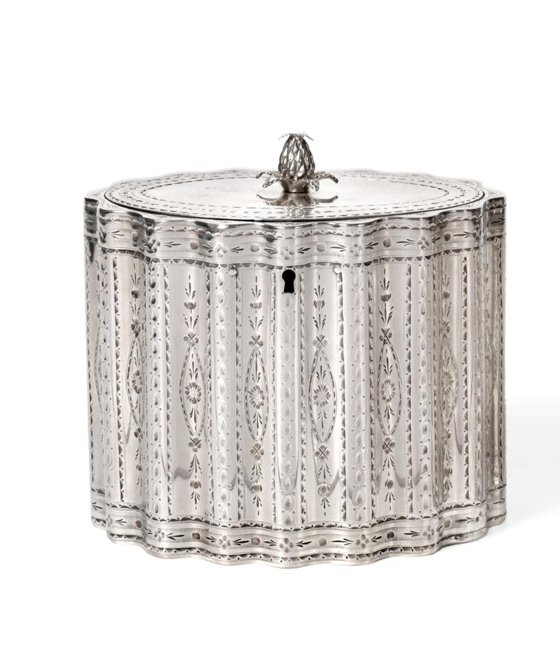 A George III Silver Tea Caddy, Robert Hennell, London 1786, of wavy oval outline with bright