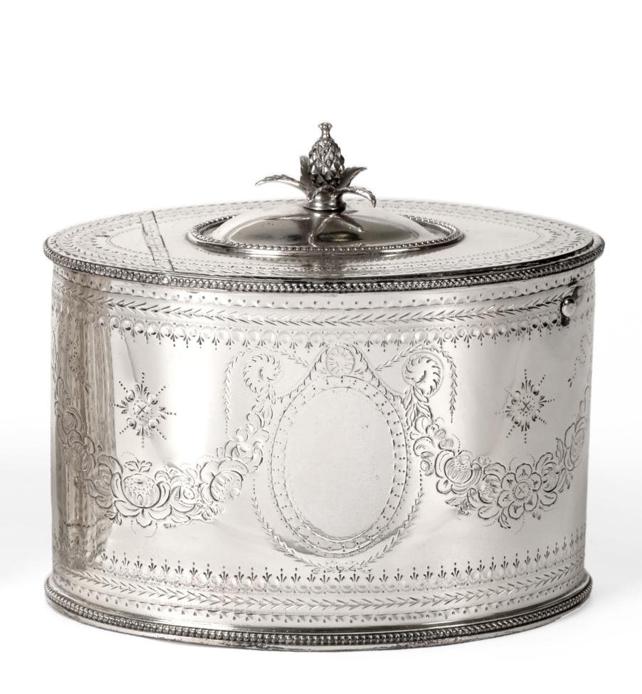 A George III Silver Tea Caddy, Thomas Daniell, London 1783, oval with bead borders, the cover hinged