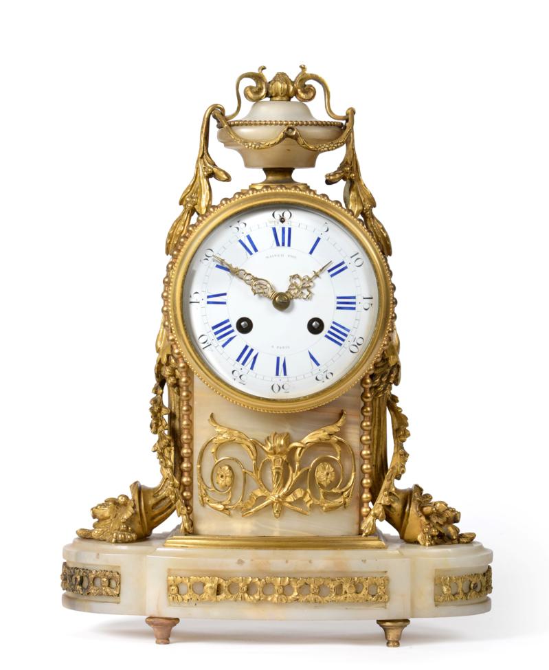 A Gilt Metal Mounted Onyx Striking Mantel Clock, signed Raingo Freres A Paris, circa 1890, urn