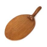 Mouseman: A Robert Thompson English Oak Cheese Board, with carved mouse signature on the board, 37.