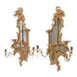 A Pair of George III Carved Giltwood Two-Branch Girandoles, circa 1760, of asymmetric form, the