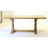 Mouseman: A Robert Thompson English Oak 6ft Refectory Table, on two octagonal legs joined by a floor