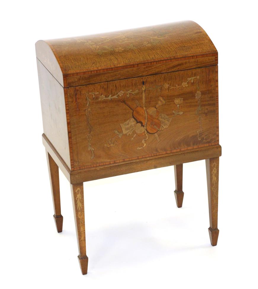 An Edwardian Satinwood, Tulipwood Banded and Marquetry Inlaid Music Cabinet, in the form of a