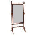 A Regency Mahogany and Ebony Strung Cheval Mirror, early 19th century, the mercury rectangular plate