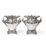 A Pair of Old Sheffield Plate Wine Coolers, circa 1820/30, of melon fluted inverted baluster