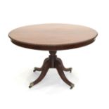 A Late George III Mahogany Circular Dining or Breakfast Table, circa 1820, with gadrooned border and