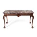 A Carved Mahogany Serving Table, in George II style, with a fleur de peche marble rectangular top