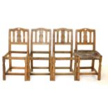 Mouseman: Four 1933 Robert Thompson English Oak Chairs, with shaped top rails above slatted backs