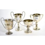 Four silver trophy cups