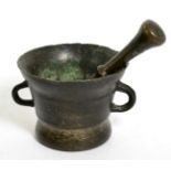 A 17th century bronze mortar, of flared form with twin loop handles, 11cm high; and a similar