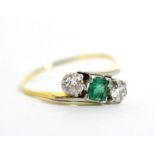 An emerald and diamond ring (shank very thin)