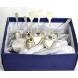 Three Georgian silver fiddle pattern tablespoons; six various silver teaspoons; a pair of