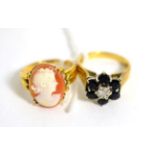 An 18 carat gold sapphire and diamond cluster ring, finger size L1/2 and a cameo ring, stamped '