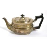 An early 20th century silver bachelors teapot, Sheffield, 1911, ebonised handle