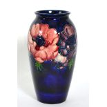 A Moorcroft pottery vase in the anemone pattern, 19cm