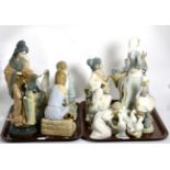 A large quantity of Lladro, Nao and similar style figures, (some damages) (on two trays)